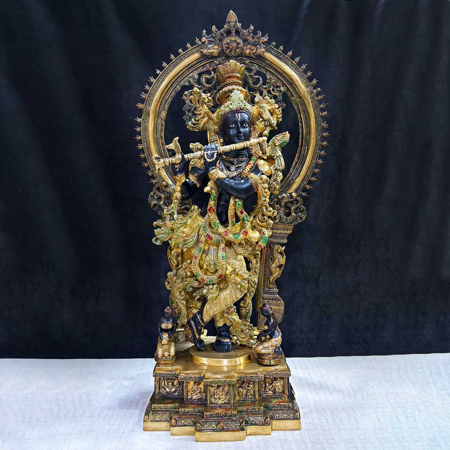 Elegant Lord Krishna Idol Standing on Engraved Base with Decorative Frame